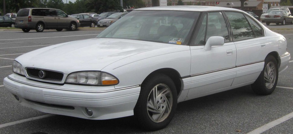 Four-door sedan with rounded front grille and integrated headlights