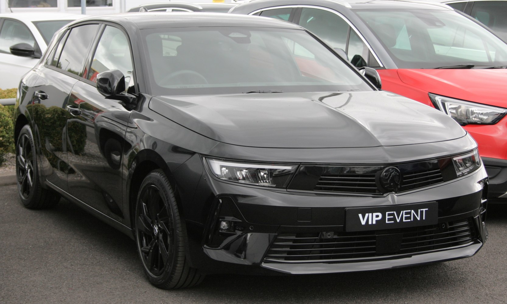 Black compact hatchback front left view with sleek LED headlights
