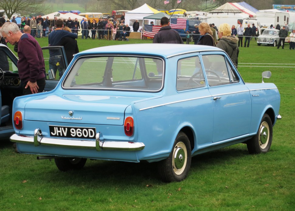 Classic sedan rear and side profile with chrome bumper and simple taillights