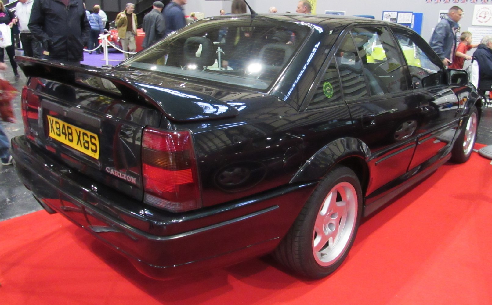 Rear view of sedan with spoiler and distinctive taillights