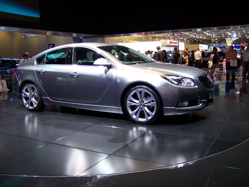 Silver 5-door hatchback with sporty alloy wheels and sleek aerodynamic design