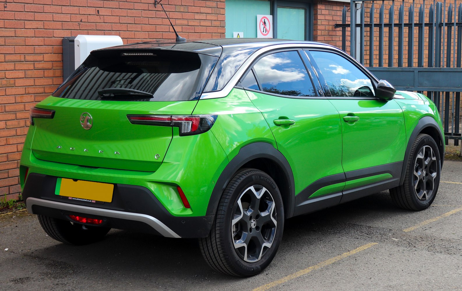 Rear and side profile with black roof and alloy wheels
