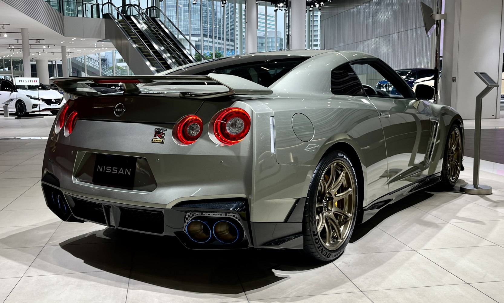 Rear view with quad exhaust, round taillights, bronze alloy wheels