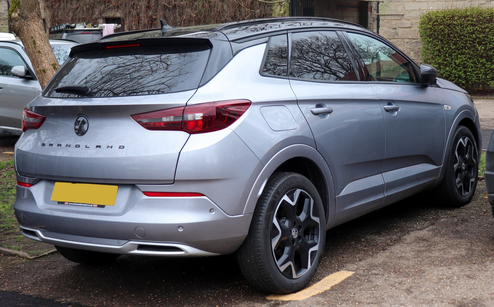 Rear view of metallic grey 2022 Vauxhall SUV with distinctive taillights and alloy wheels