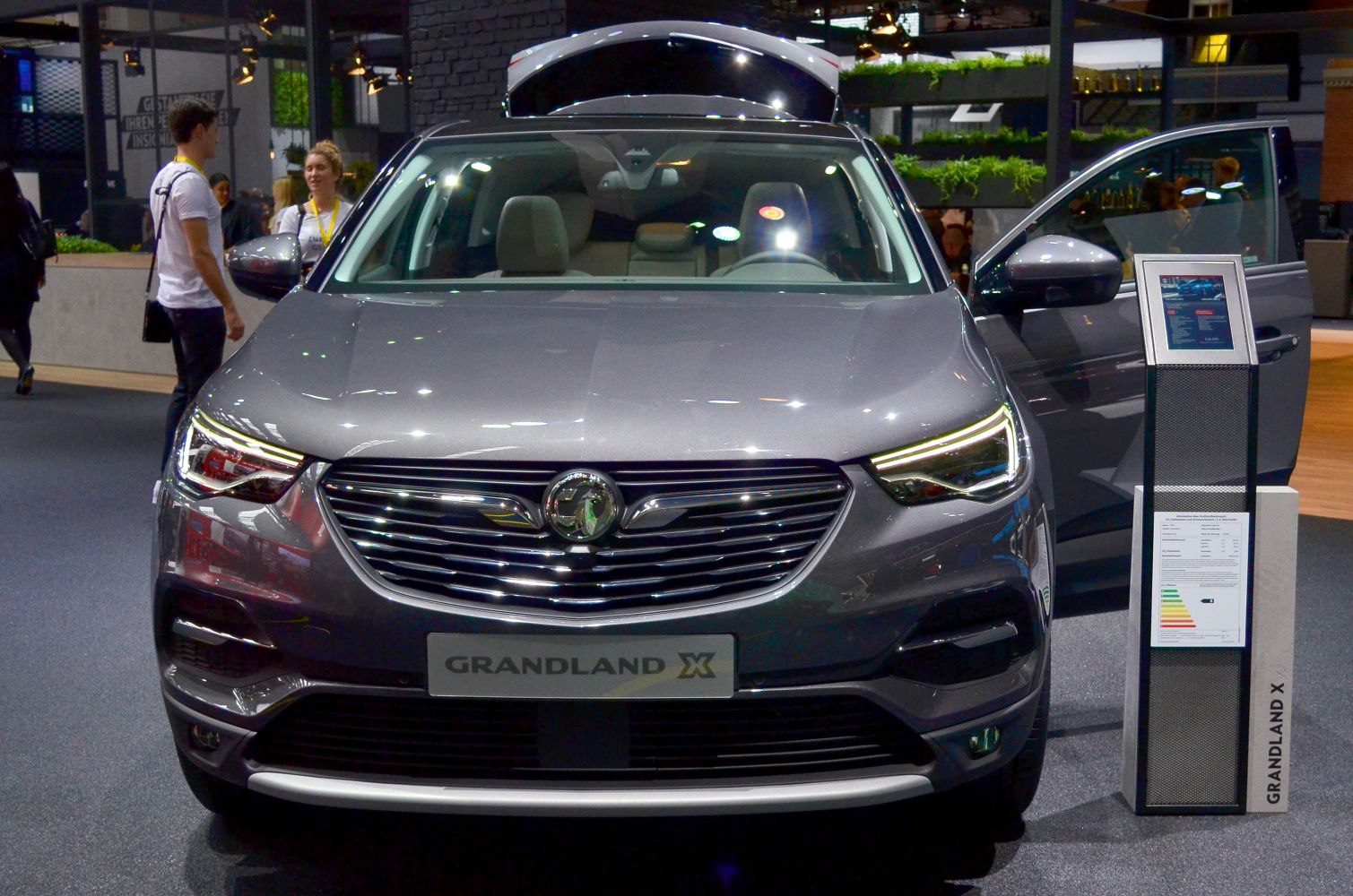 Front view of a modern SUV with LED headlights and wide grille