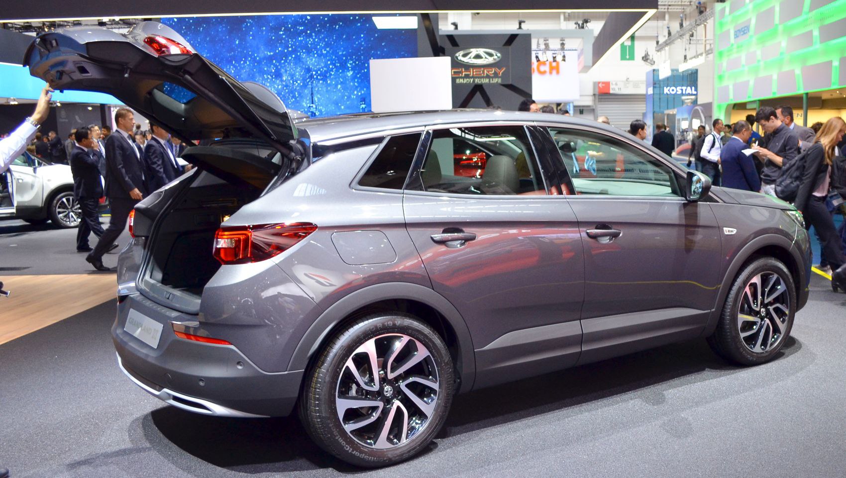 Open rear tailgate and prominent alloy wheels on a modern SUV.