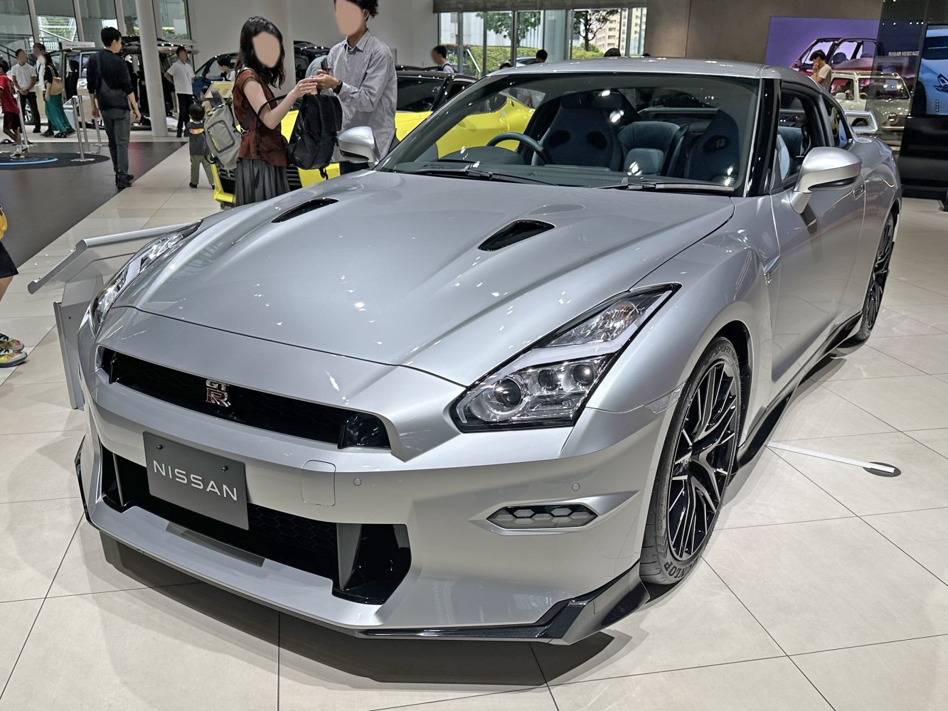 Aggressive front fascia with quad headlights and hood vents