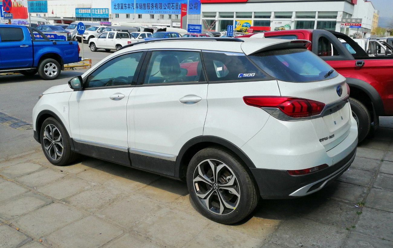 Rear side view of compact SUV with distinctive taillights and alloy wheels