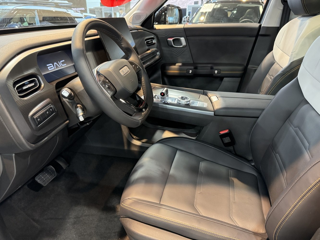Modern dashboard with digital display and premium front seats
