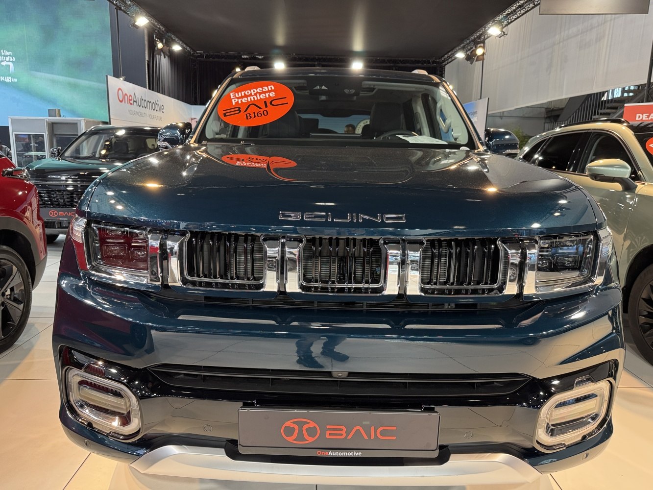 Front view of robust grille and headlight design on SUV.