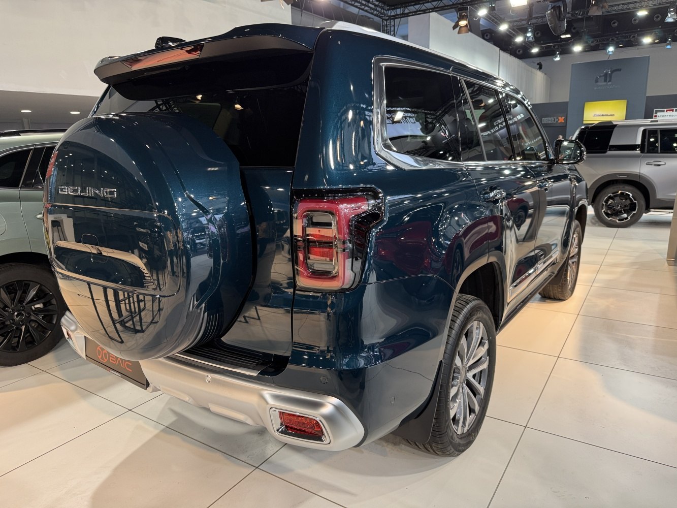 Rear view with rear-mounted spare wheel and distinctive LED tail lights
