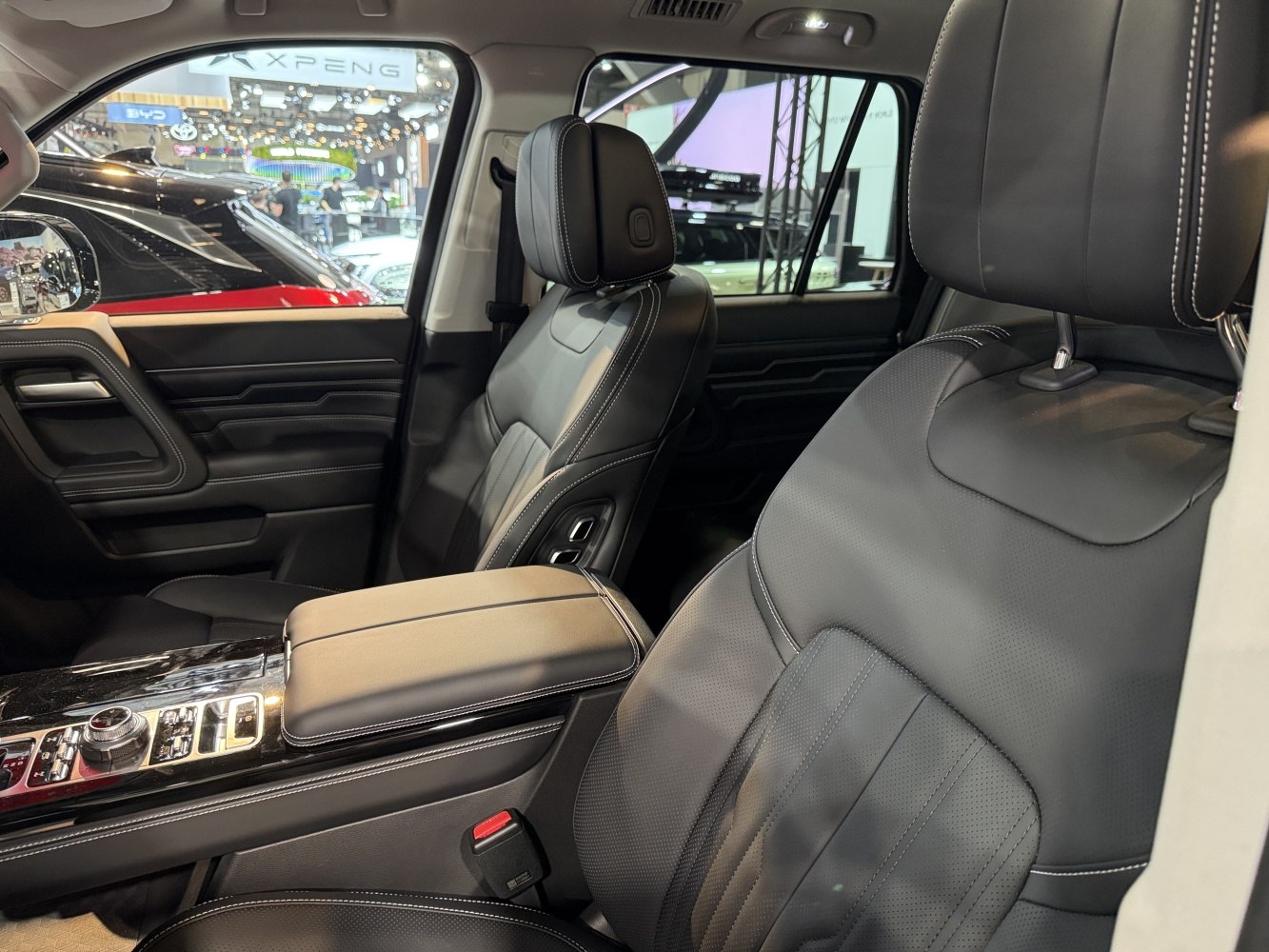 Black leather seats and advanced center console with detailed stitching