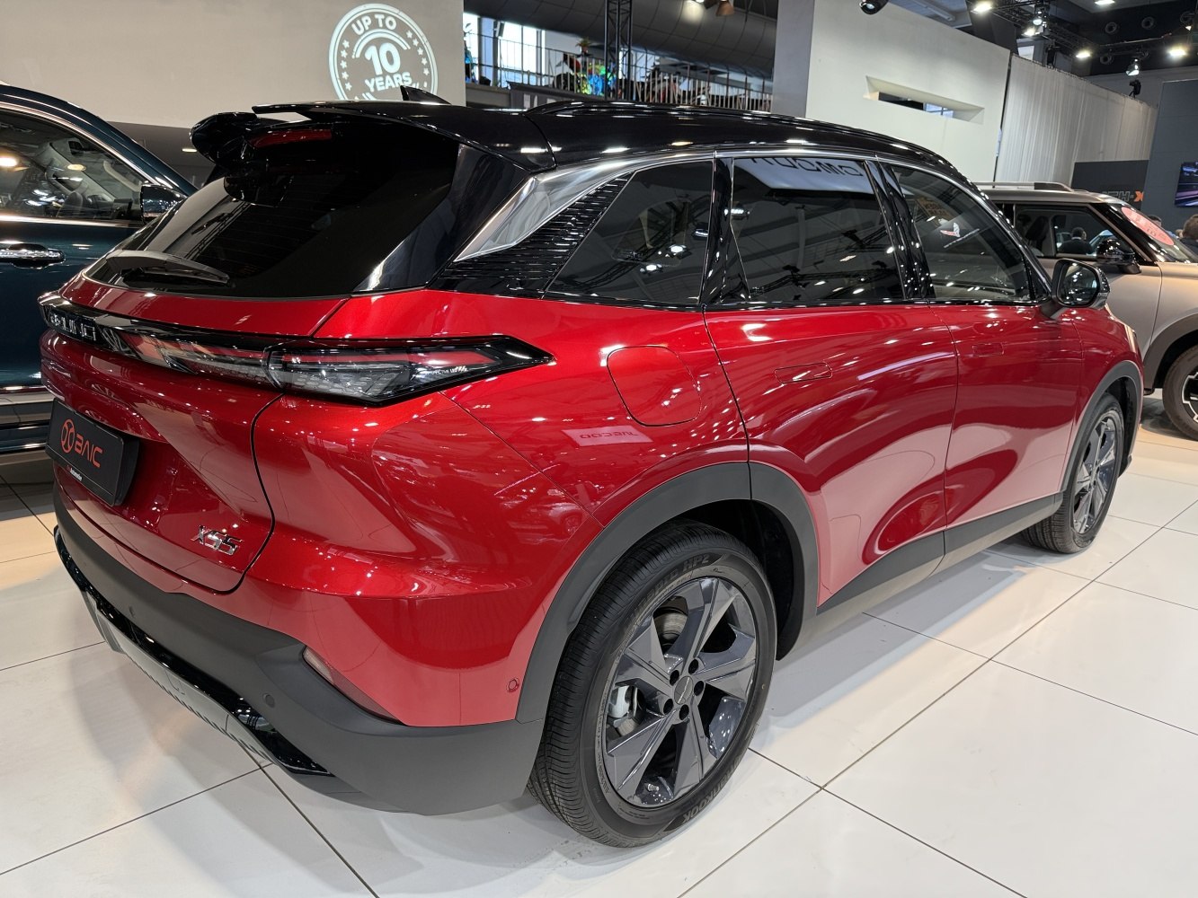 Rear design with sleek tail lights and modern alloy wheels on red SUV