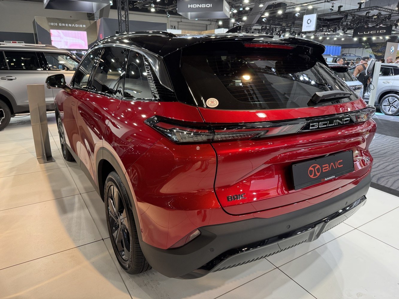 Sleek red SUV rear with LED tail lights and black roofline