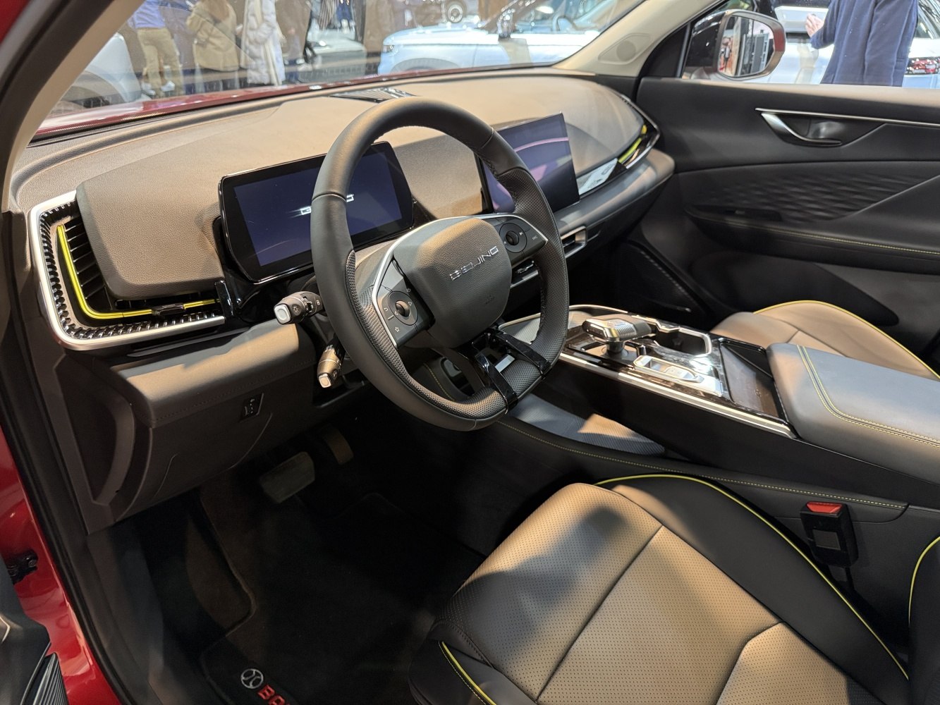 Dual digital screens, leather seats, and modern dashboard with steering wheel controls