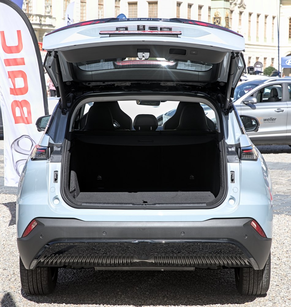 Open tailgate revealing spacious rear cargo area and trunk interior.