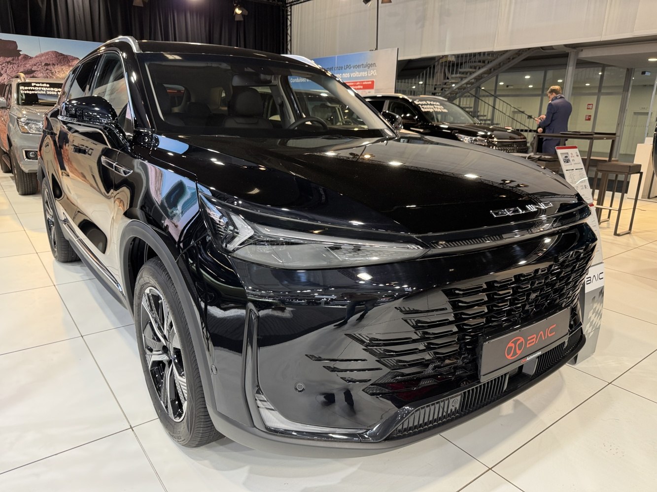 Bold front grille and sleek LED headlights on a modern SUV.