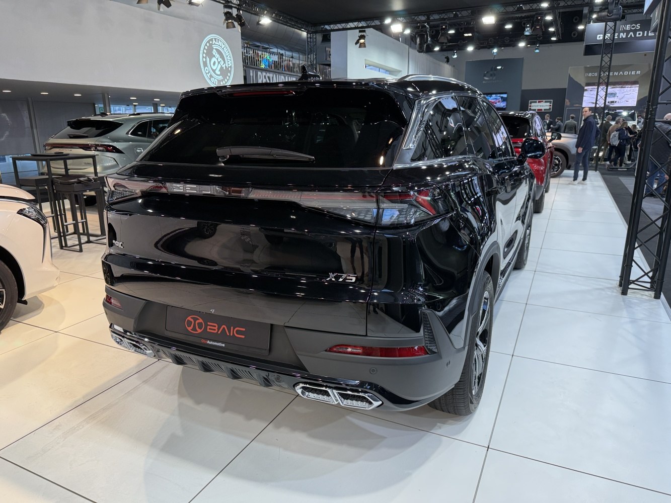 Rear view with LED tail lights and dual exhausts on a modern SUV