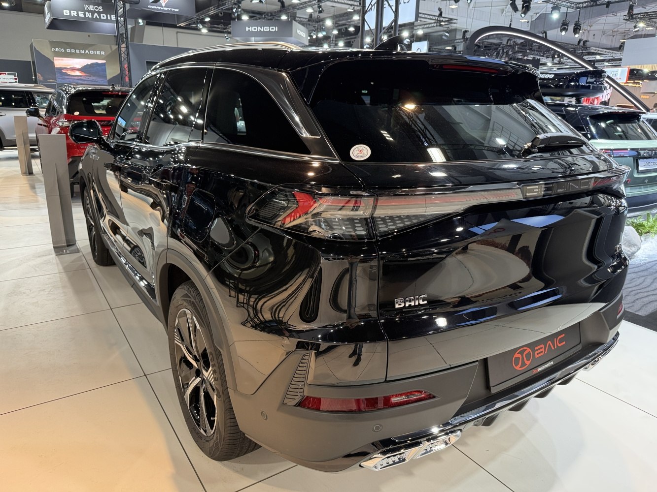 Rear and side view of sleek black SUV with modern tail lights and sporty bumper