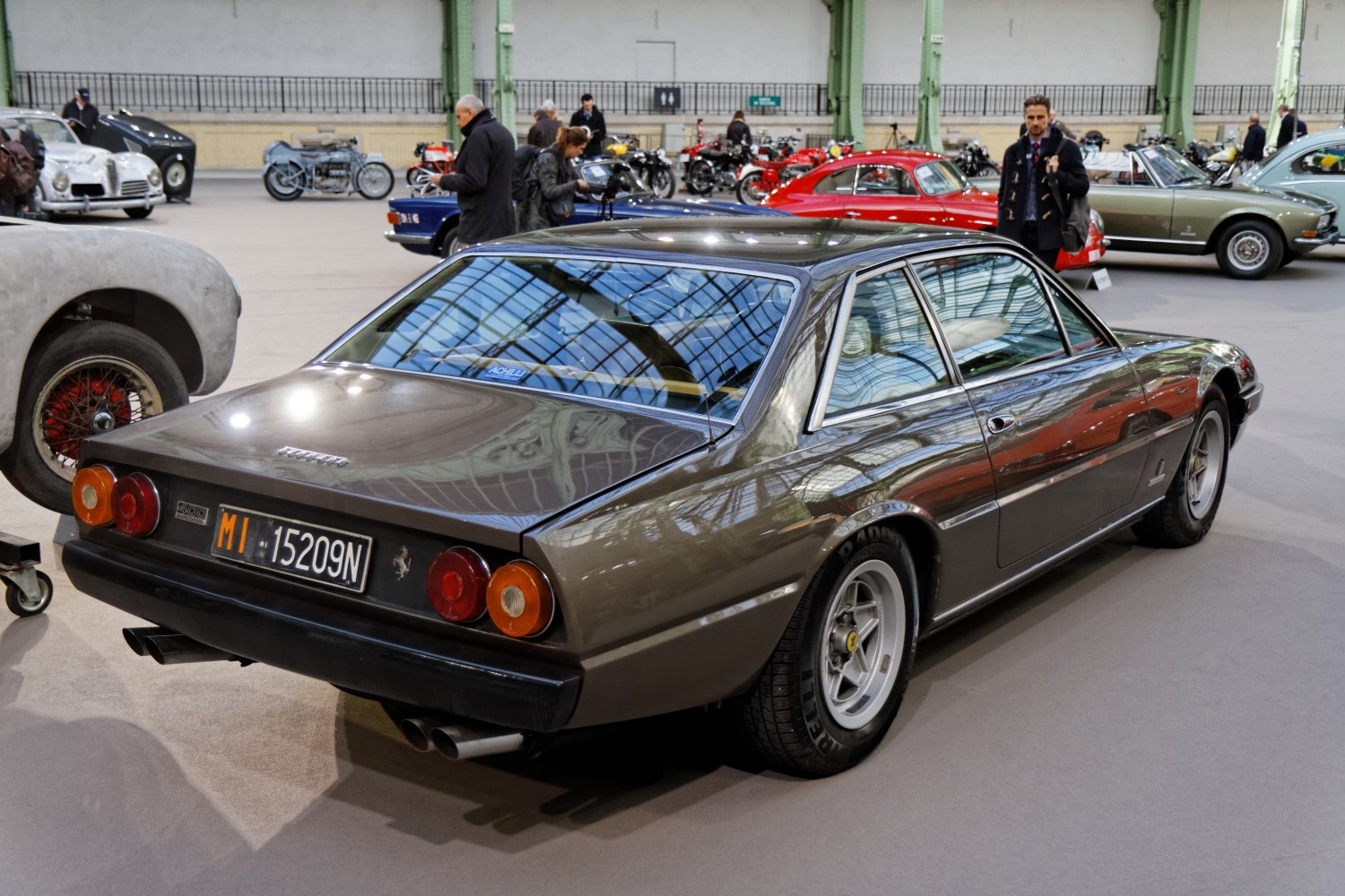 Rear view showing quad round taillights and dual exhaust pipes.