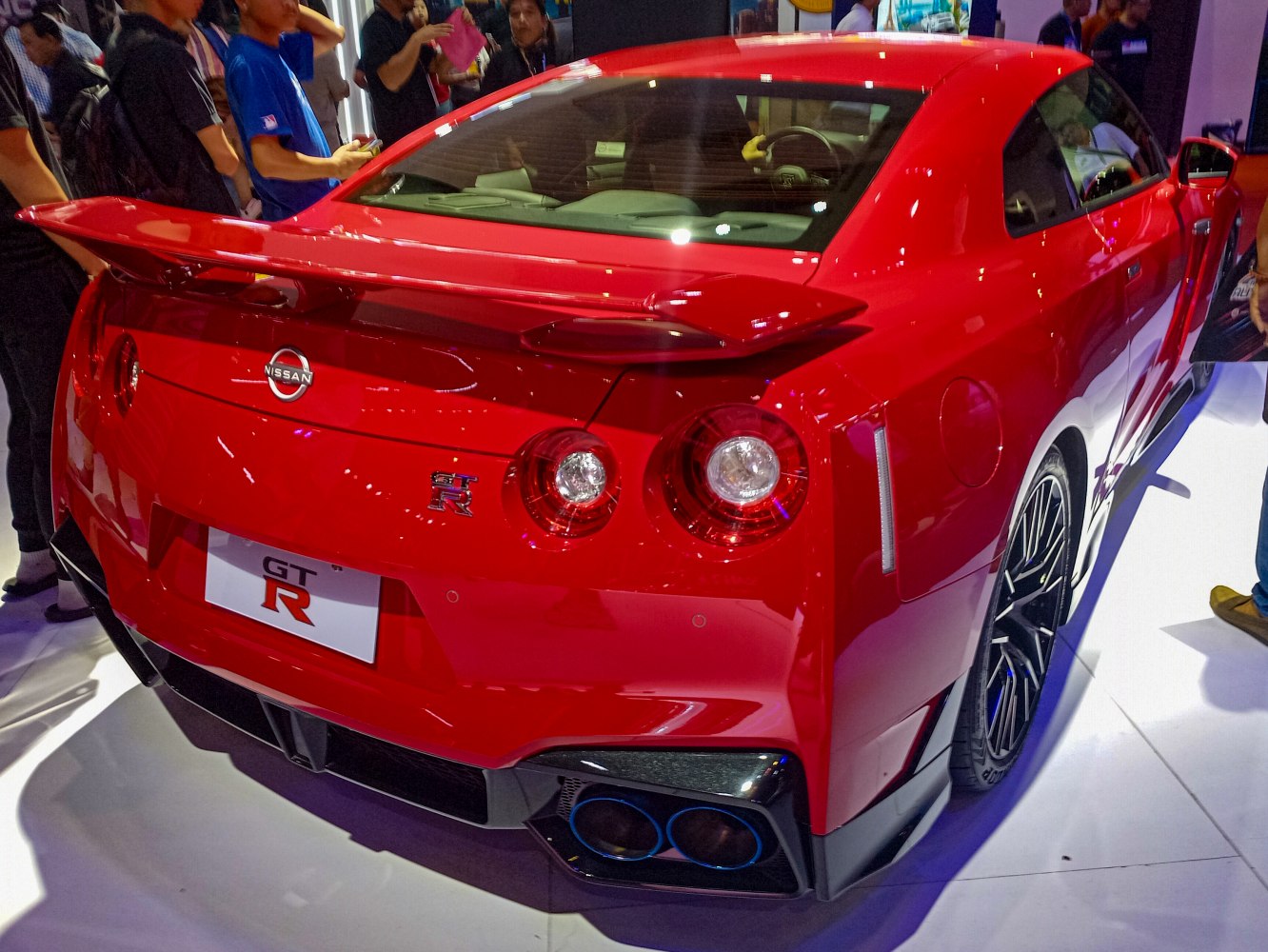Rear side view with quad round taillights and large rear spoiler