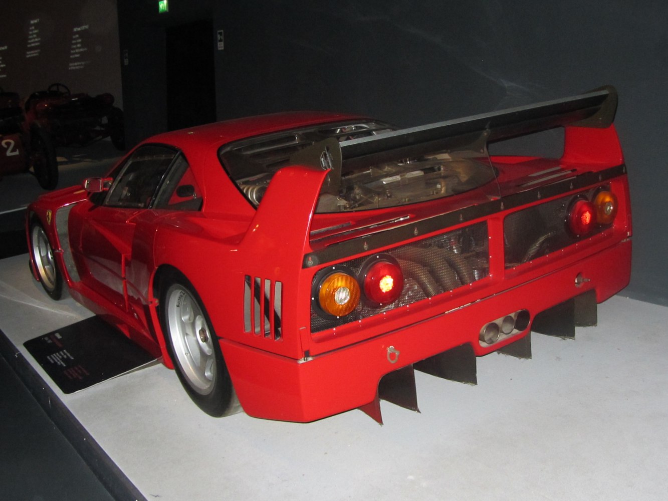 Rear wing, diffuser fins, exposed engine, vintage racing rear design.