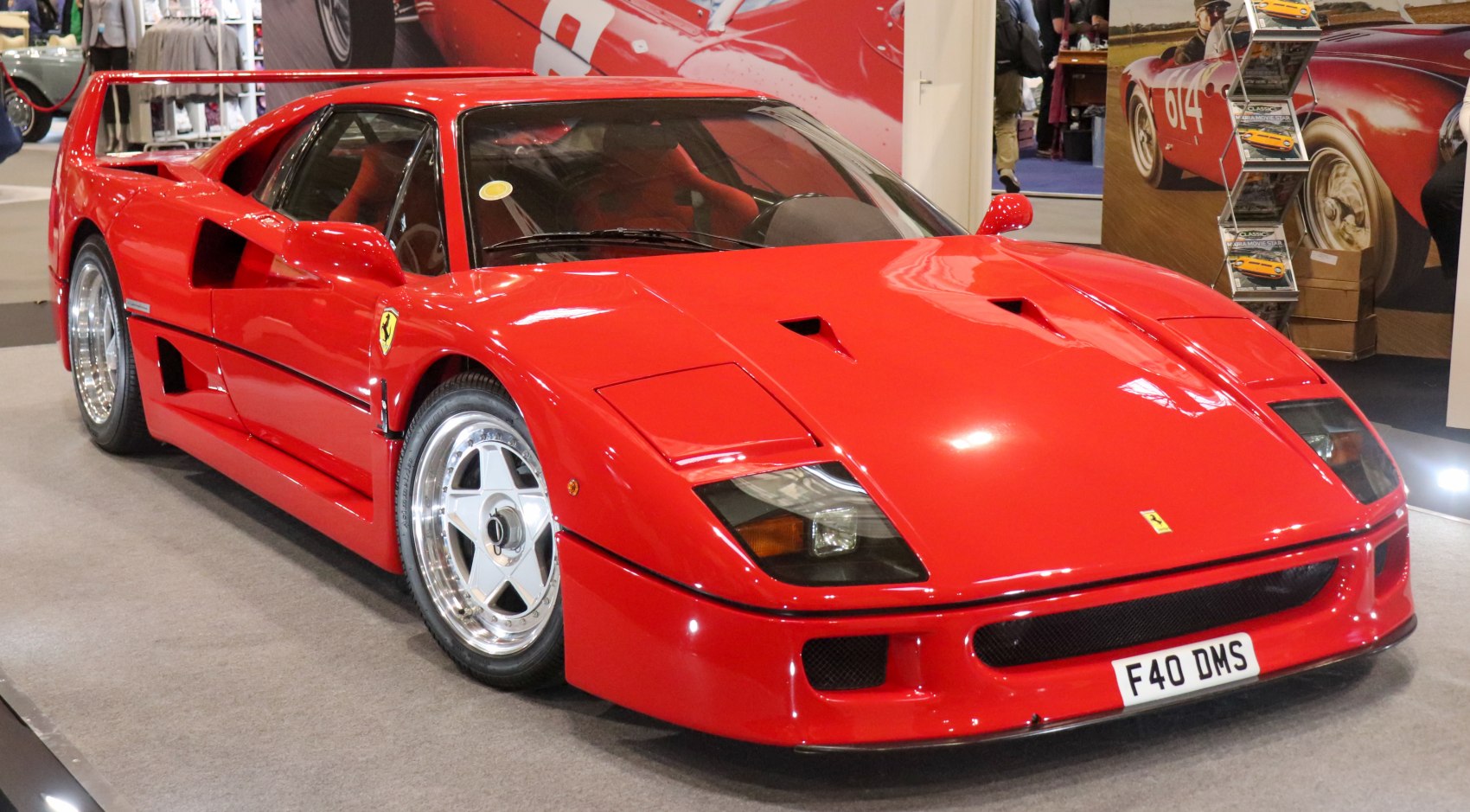 Red sports car with angular body, pop-up headlights, and rear spoiler