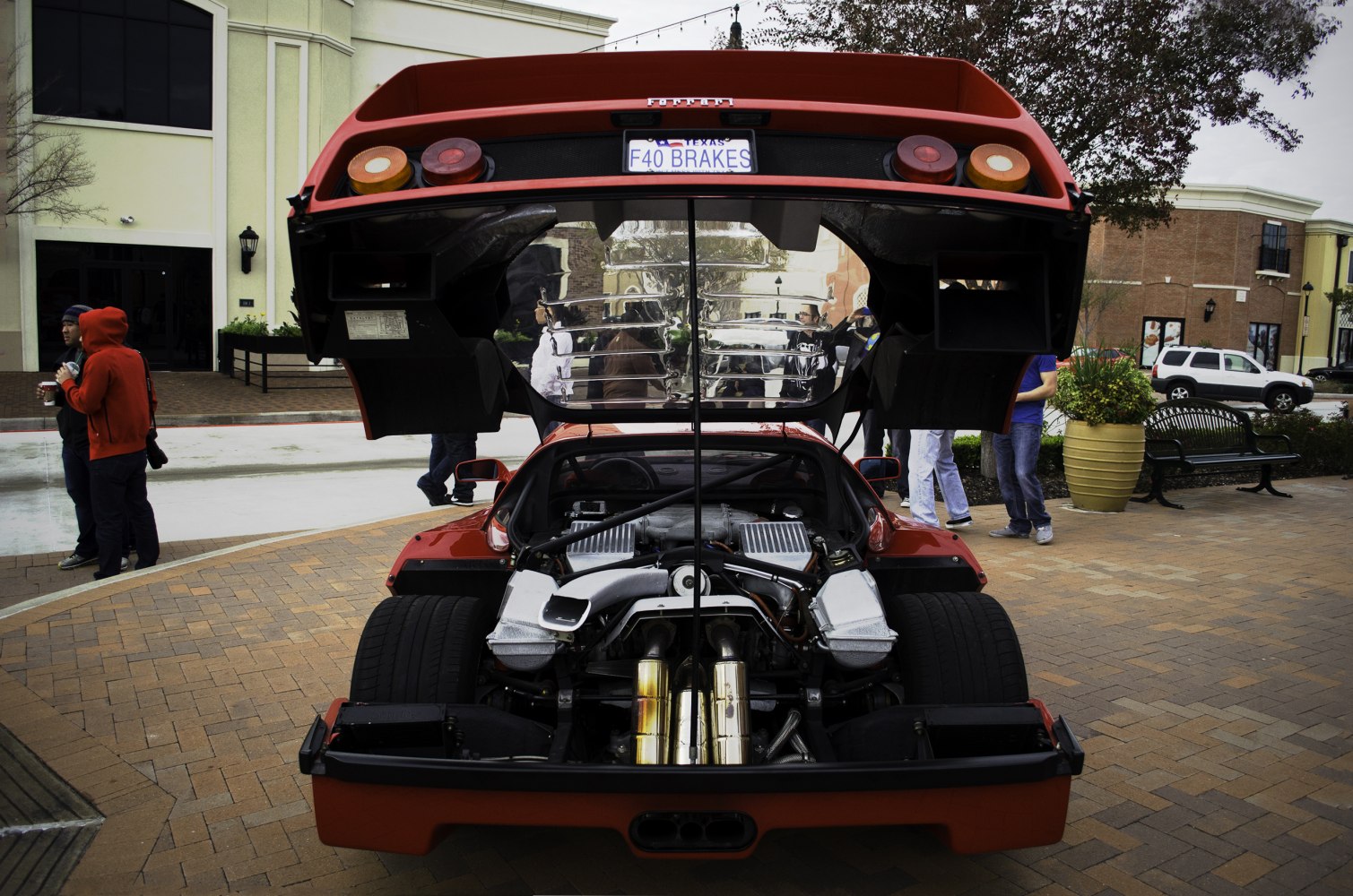 Open rear engine bay with twin-turbo V8 and exhausts