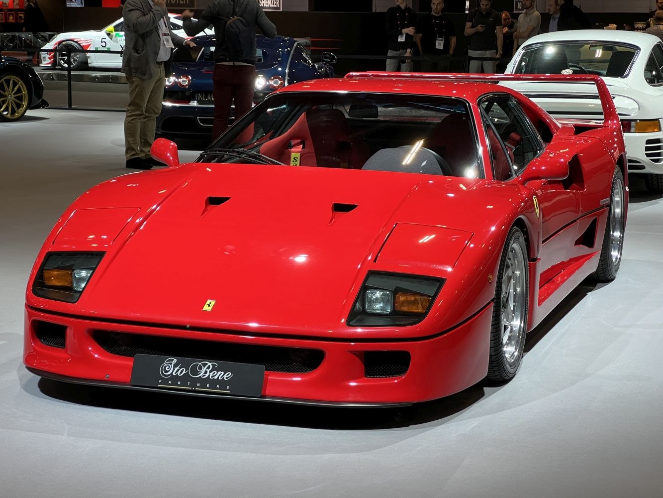 Red sports car with rear spoiler and pop-up headlights