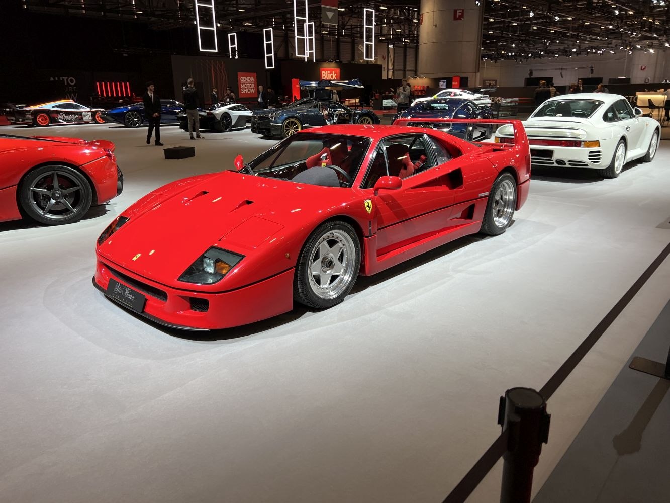 Distinctive rear wing and pop-up headlights of a classic red sports car.