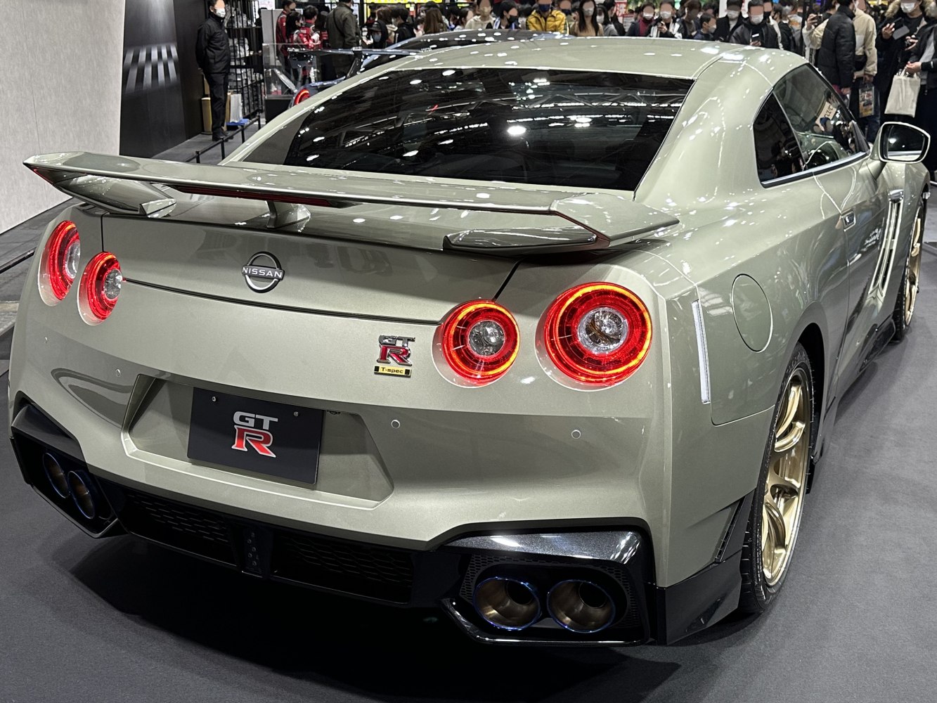 Rear view with quad round tail lights and prominent rear spoiler