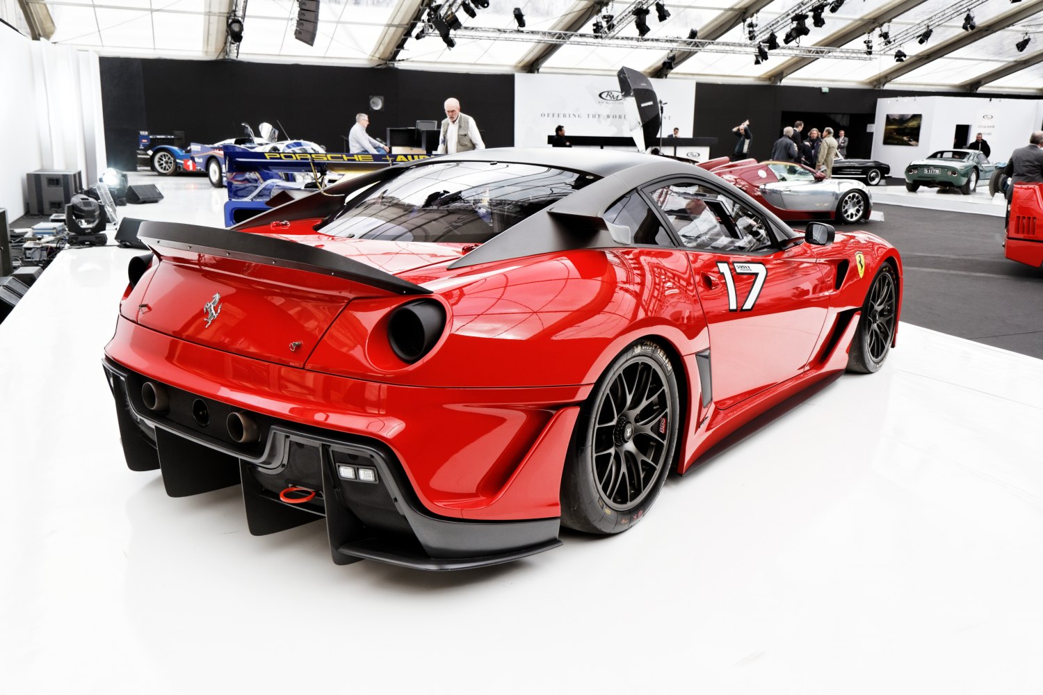 Red racing car with large rear wing and aerodynamic diffuser