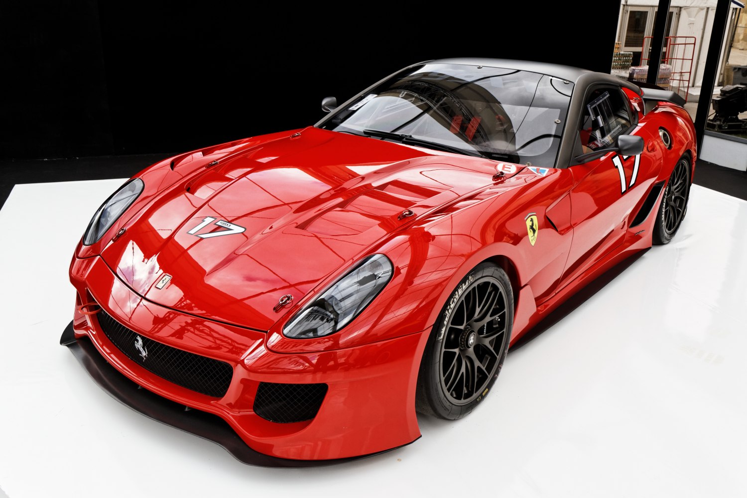 Red racing coupe with aerodynamic body kit and large rear wing