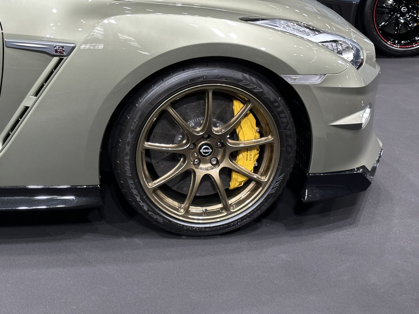 Bronze alloy front wheel with yellow brake caliper