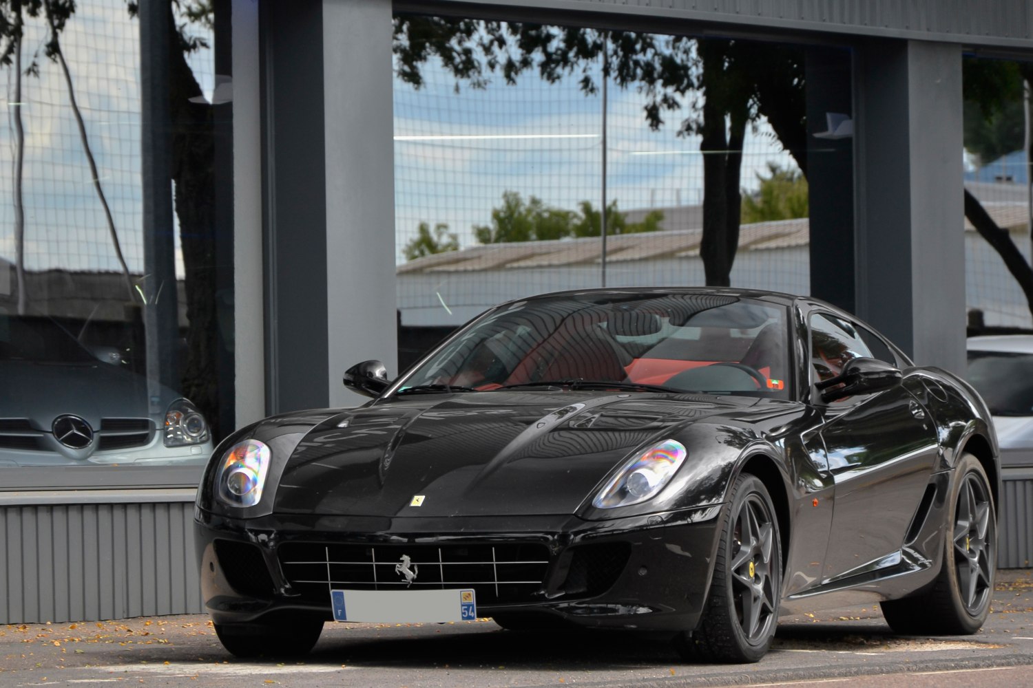 High-performance black sports coupe with aggressive front design and aerodynamic features