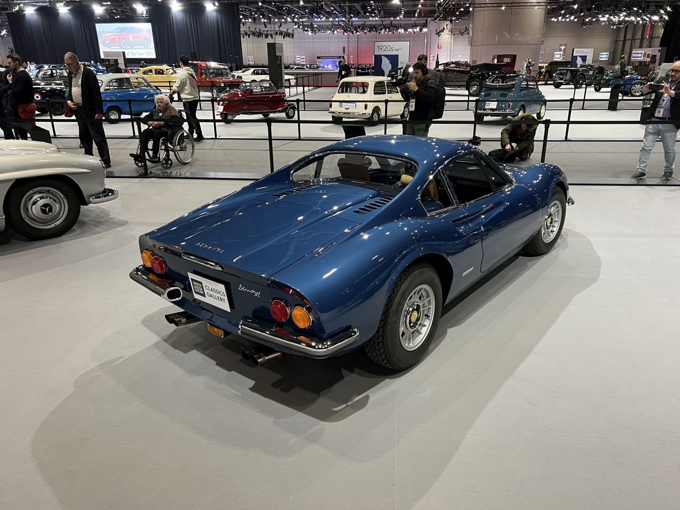 Blue classic coupe rear view with round taillights and sporty lines