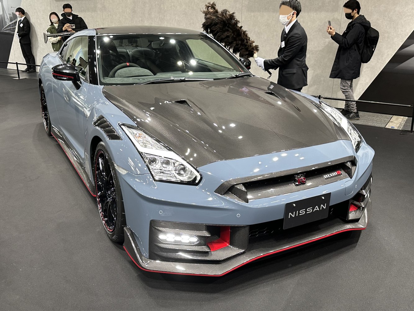 Front view of sports car with carbon fiber hood and LED headlights