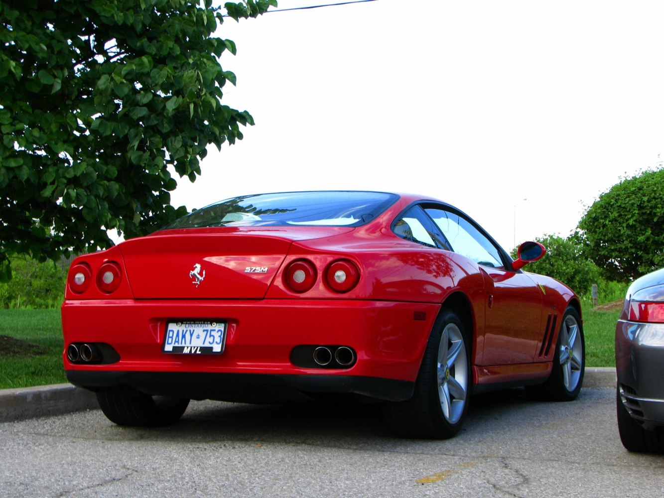 Rear view with triangular tail and quad exhausts
