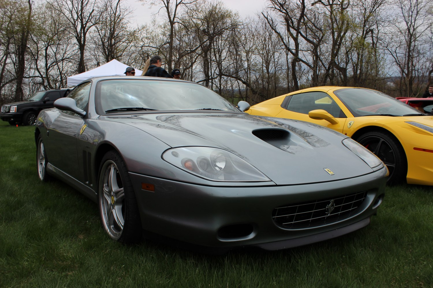 High-angle front-side view highlighting hood scoop and sleek lines