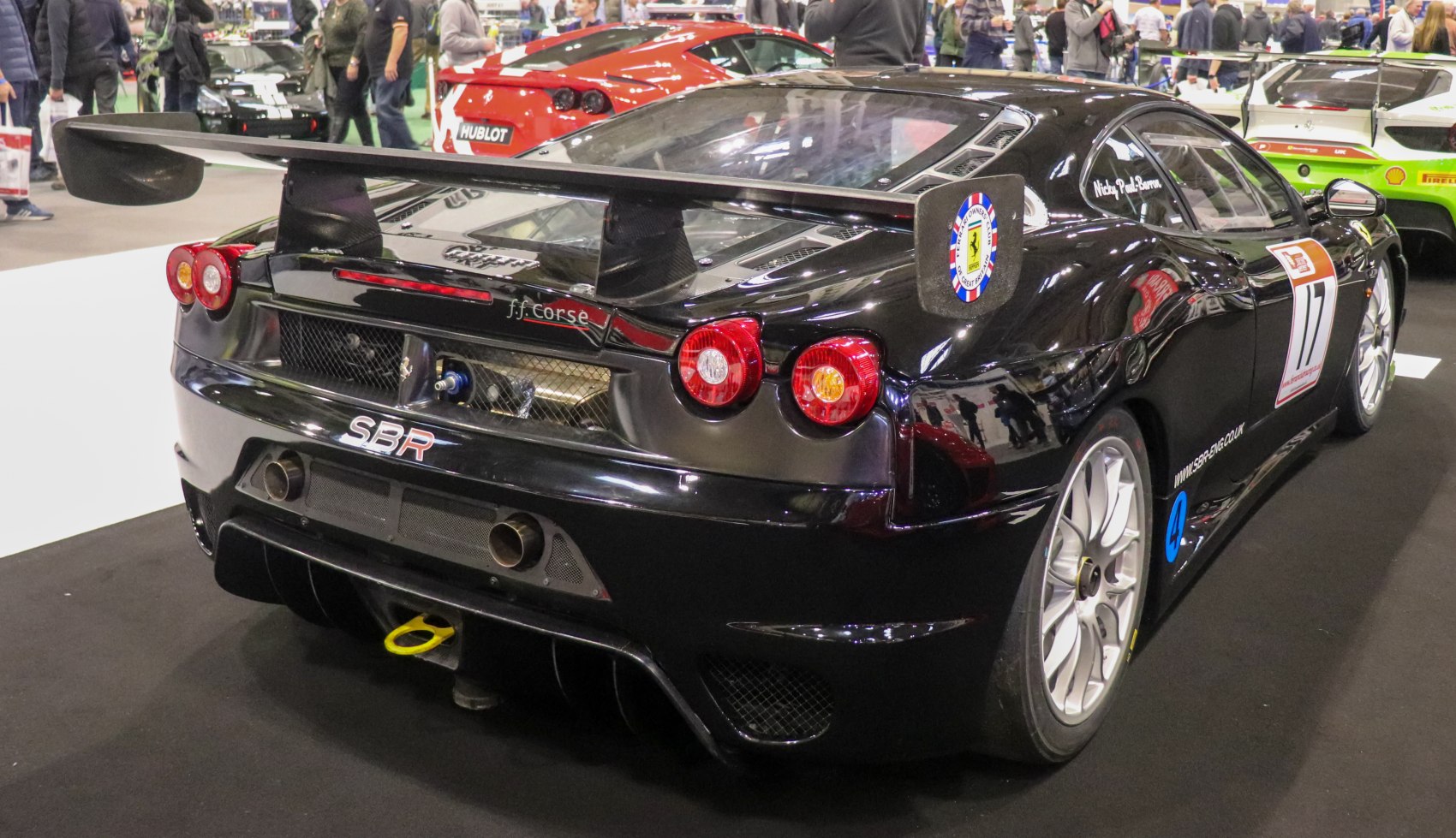 Race car rear with large spoiler and dual round taillights