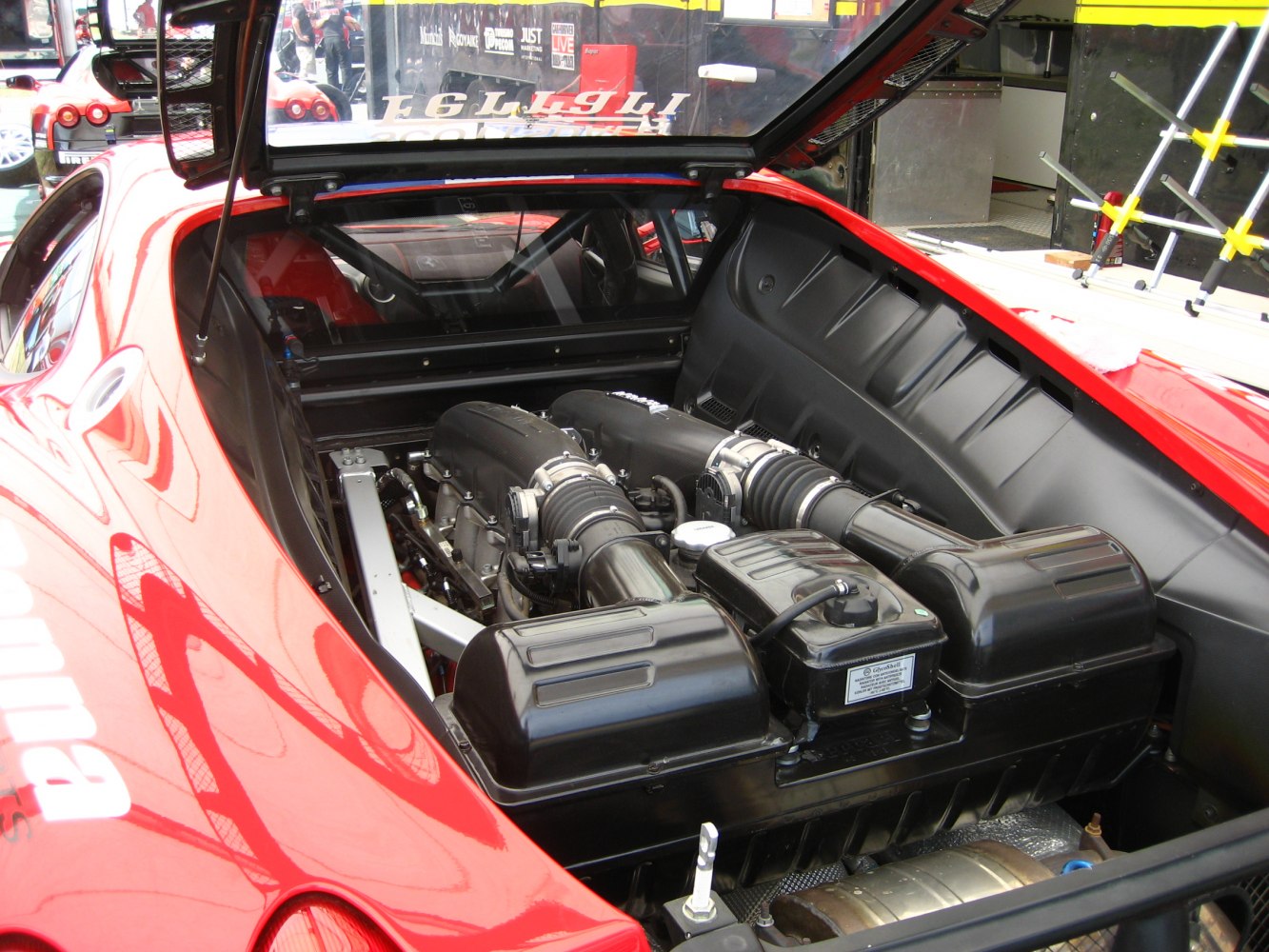 Rear mid-engine bay showing high-performance engine layout.