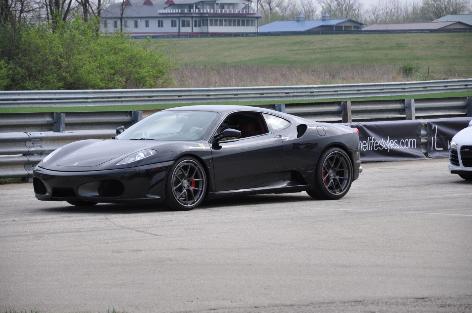 Side view of sleek black sports coupe with performance wheels