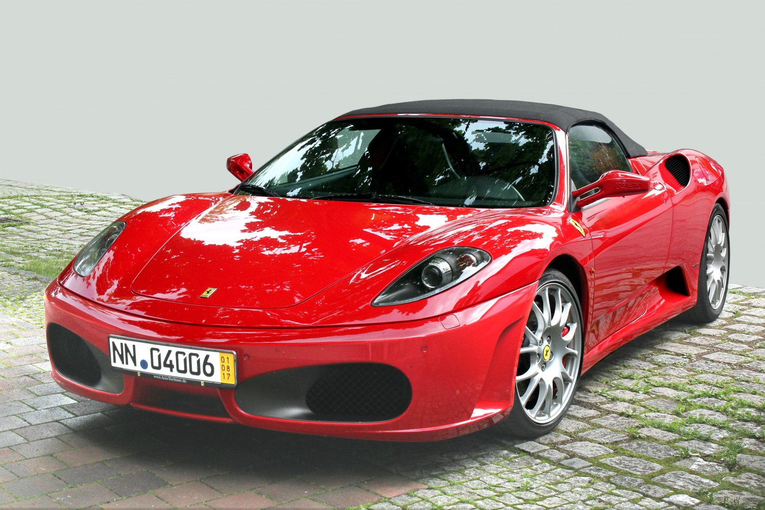 Red convertible sports car front and side view