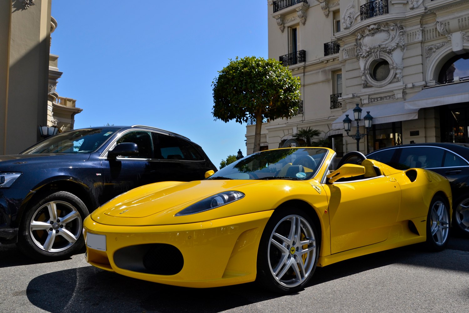 Yellow convertible sports car with aerodynamic body and alloy wheels