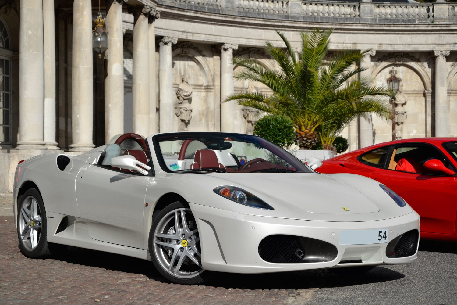 Convertible sports car with red interior and alloy wheels