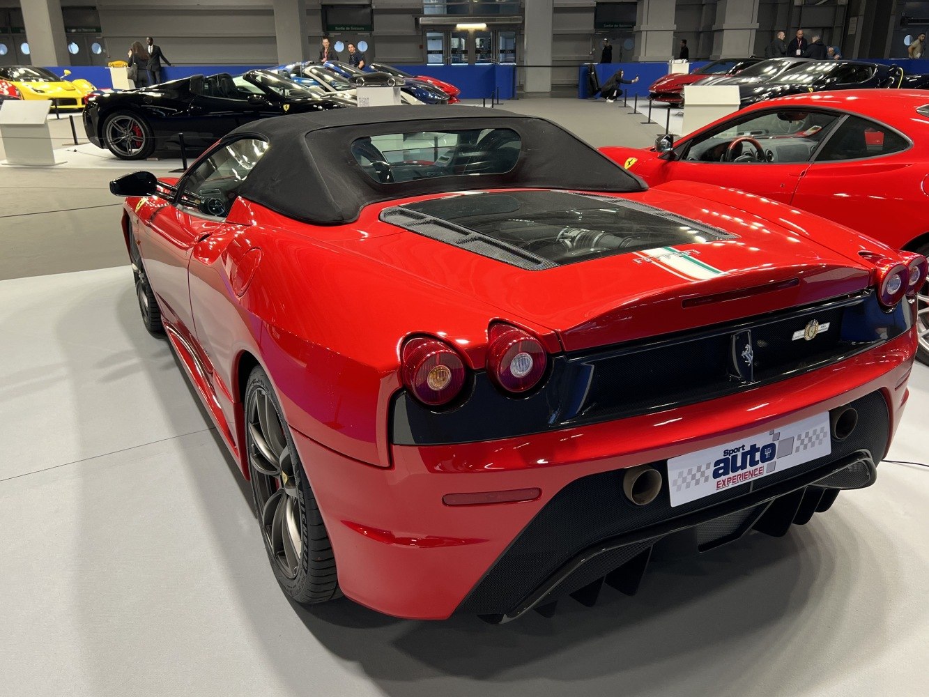 Rear view of convertible with soft top and glass engine cover