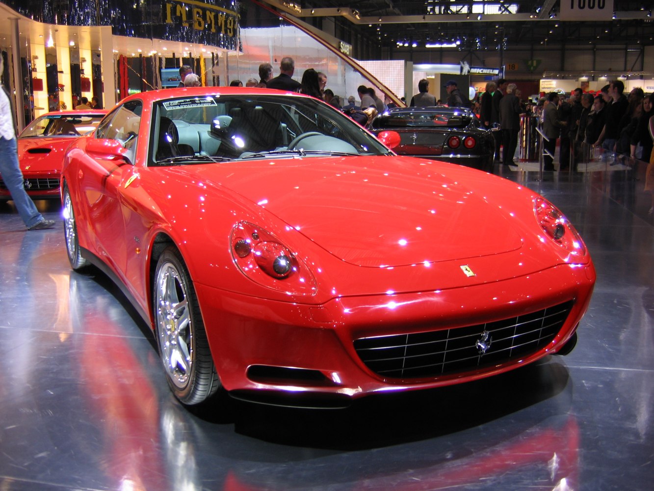 Front view showcasing grille and headlights of a sleek sports coupe