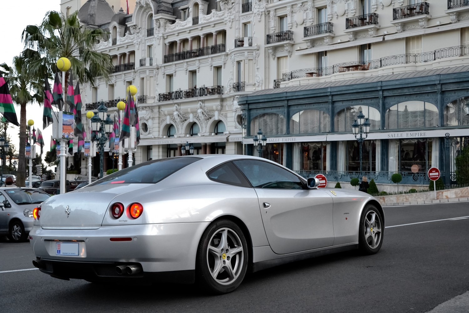 Silver sports coupe rear view with round taillights and dual exhaust