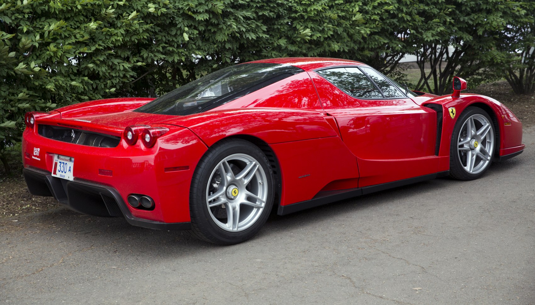 Rear-side view of a sleek, aerodynamic high-performance sports car