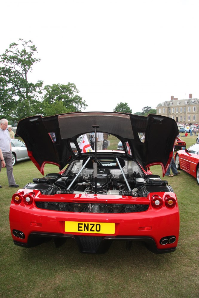 Rear engine bay with hood open and visible car rear features